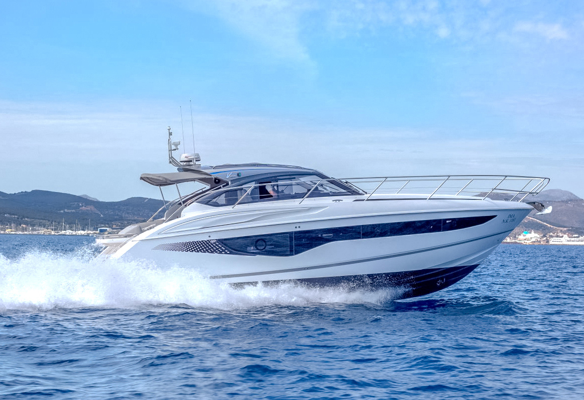 A Princess V40 tearing through blue waters